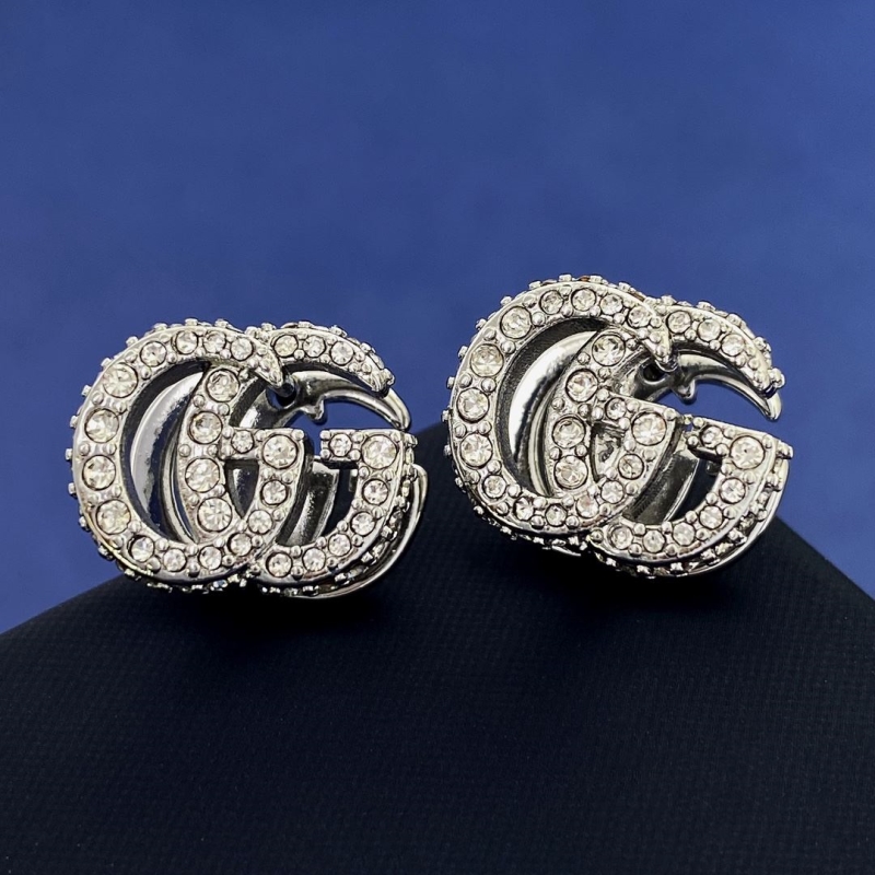 G*u*i earrings